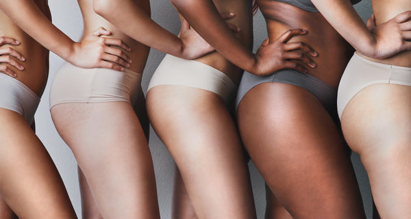 Group of women displaying their stretch marks 